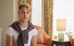 video14 Hispanic male in room with window and chair behind him talking to camera