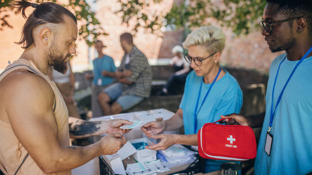 SSP workers provide food and aid Workers provide food and aid at a syringe services program (SSP) site.