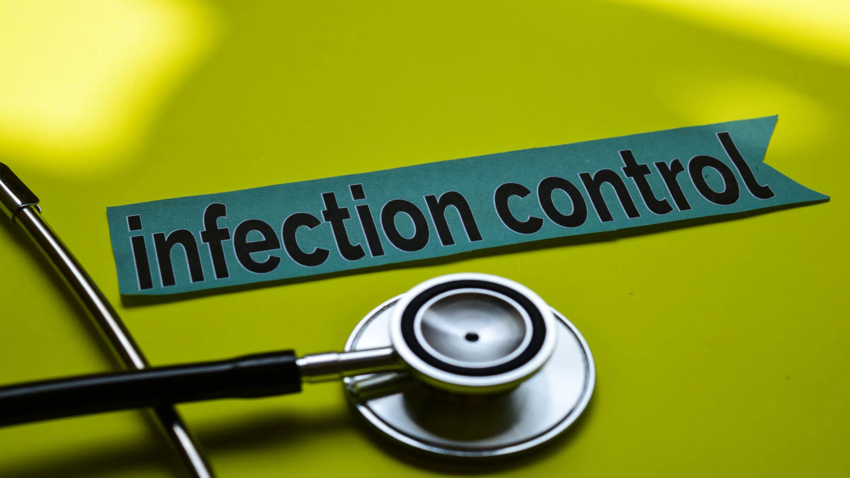 Infection Control Graphic Yellow background with infection control words and stethoscope