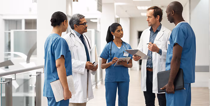 doctorstalkingwitheachother.jpg Diverse group of doctors talking
