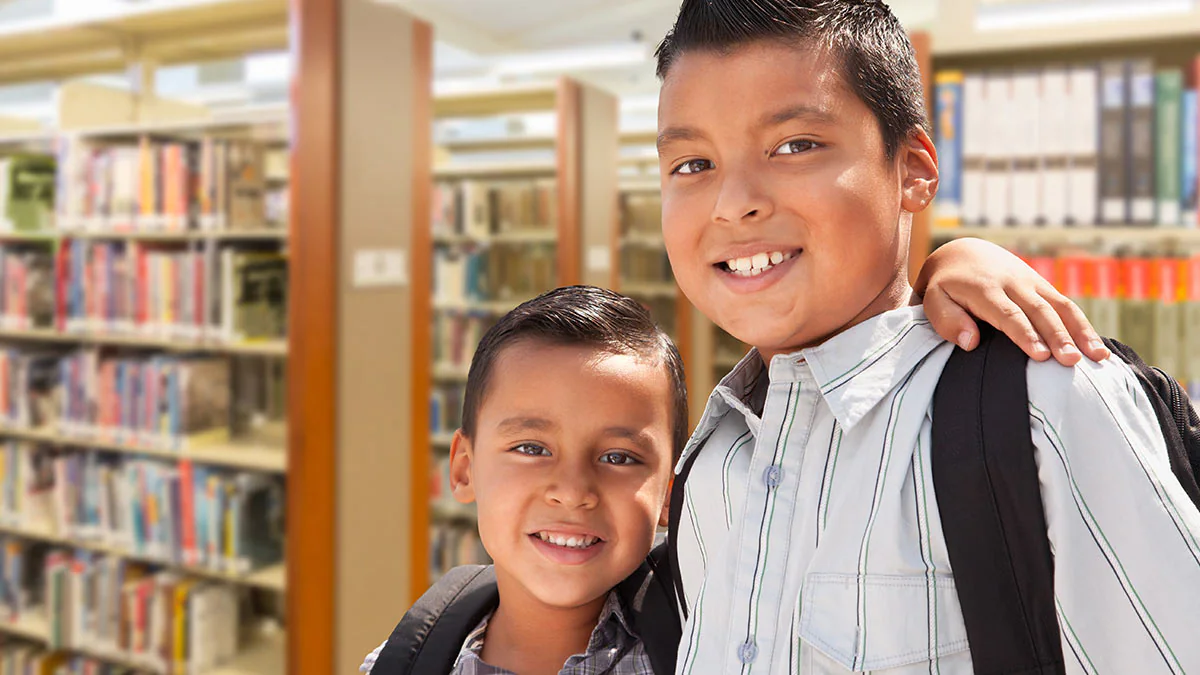 Hispanic/Latino Youth Young siblings in a library