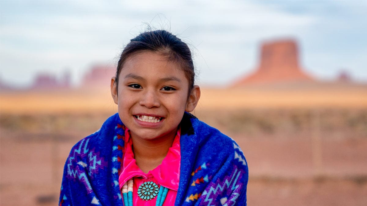 American Indian girl Young girl in front of desert background.