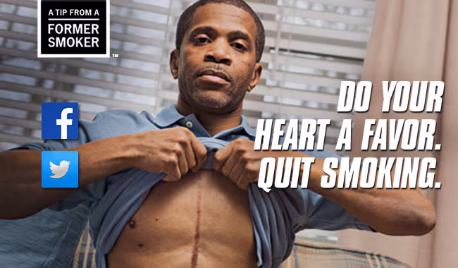 A Tip From a Former Smoker - Do you heart a favor. Quit Smoking. Picture of Tips participant Roosevelt lifting his shirt to show the audience his scar from his heart surgery.