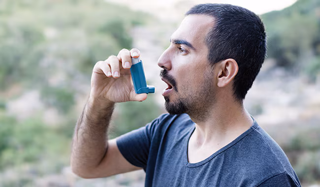 Man using inhaler