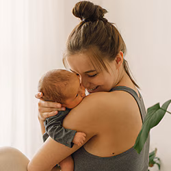 mother with new born for tdap vaccine to protect against whooping cough Mother with newborn baby
