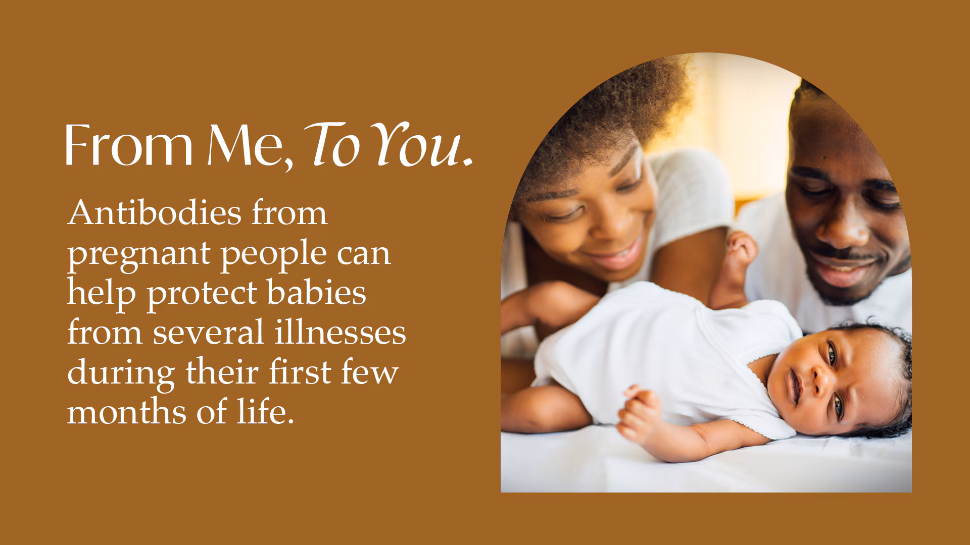 An adult couple looking at their newborn.