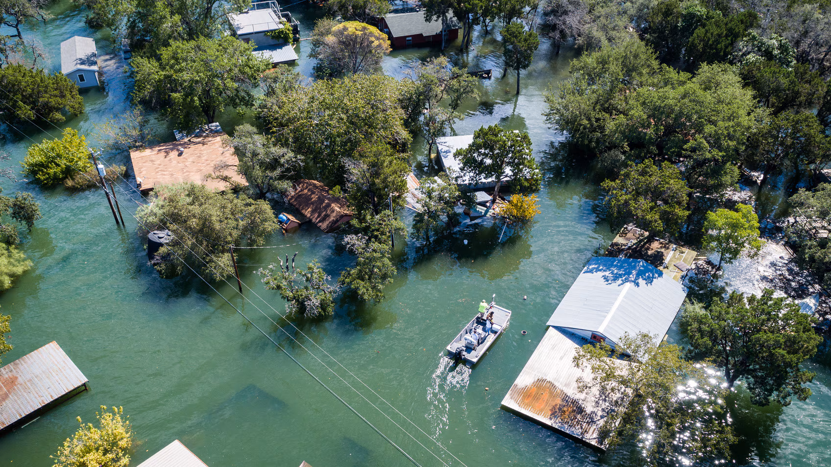 Aerial image of a neighborhood that is flooded after a natural disaster.