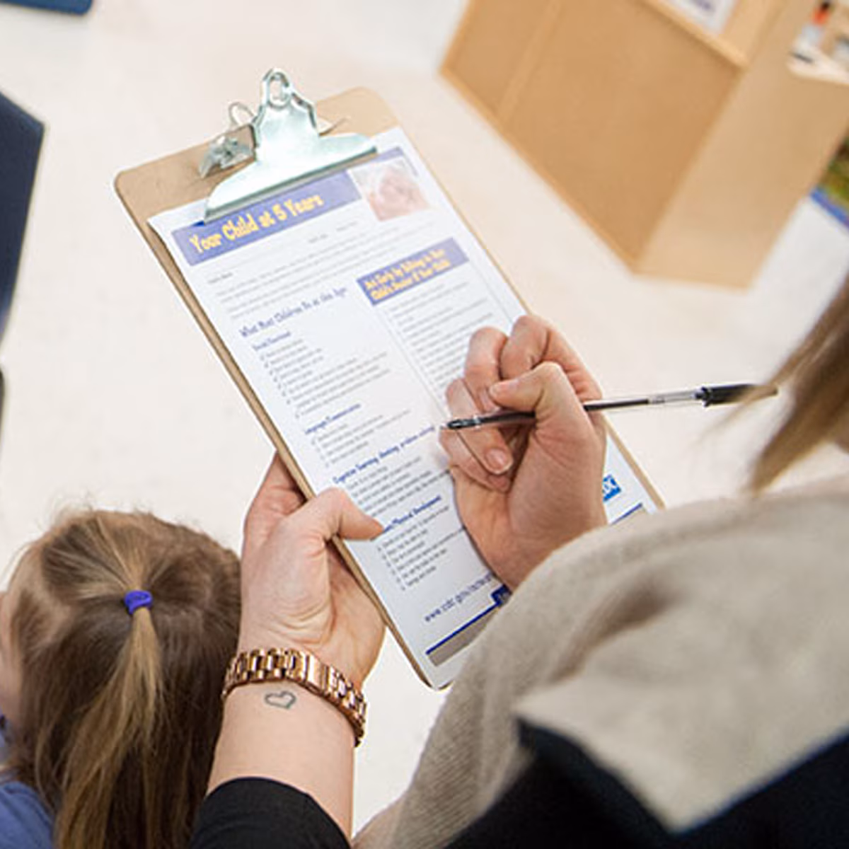 Your child at 5 yerars paperwork being filled out.