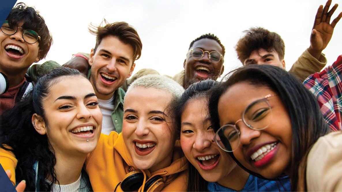 LGBTQ A group of multiracial teenagers, smiling and laughing.